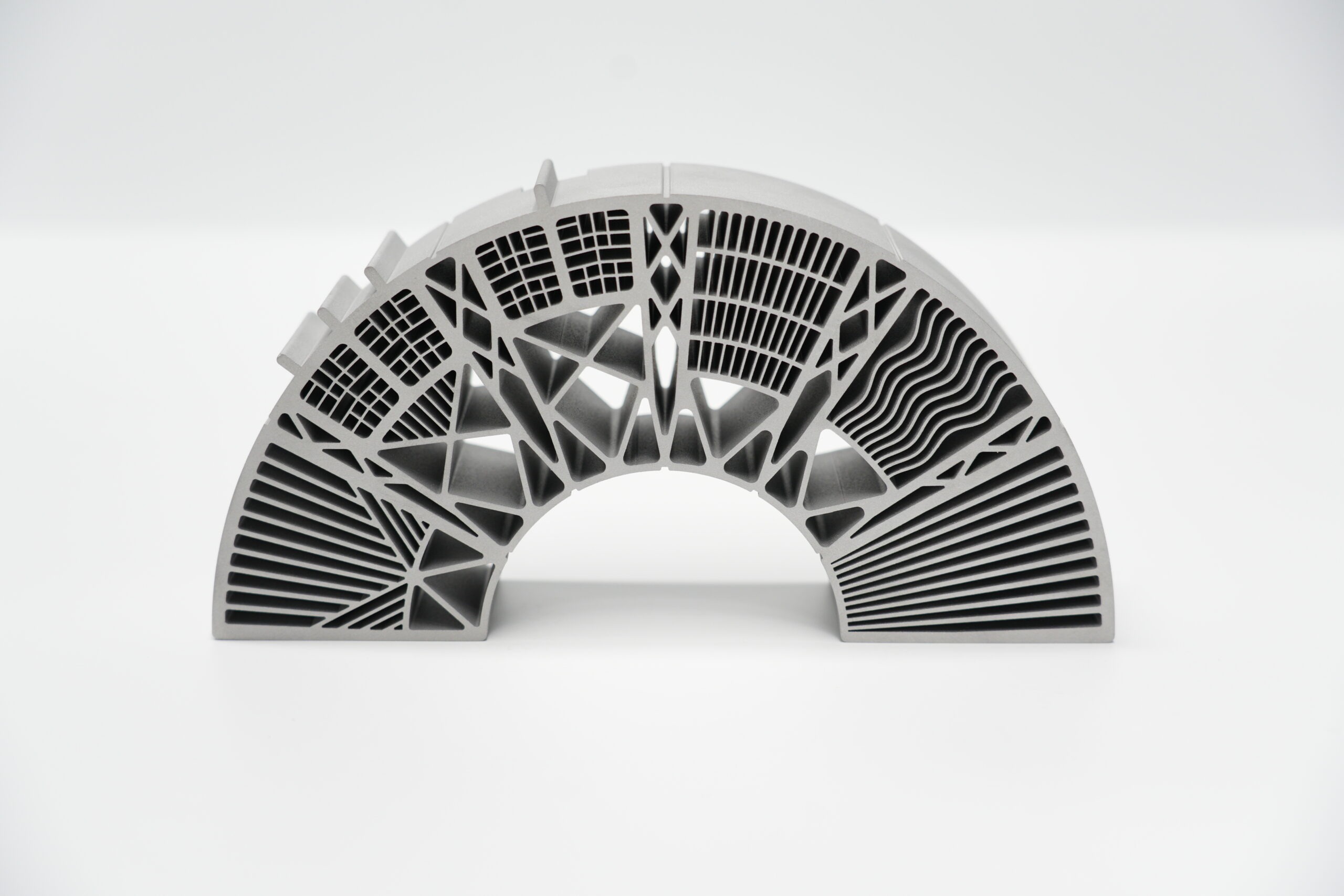 Metal additive semi-circular arch sample with multiple lattice and fin geometry segments