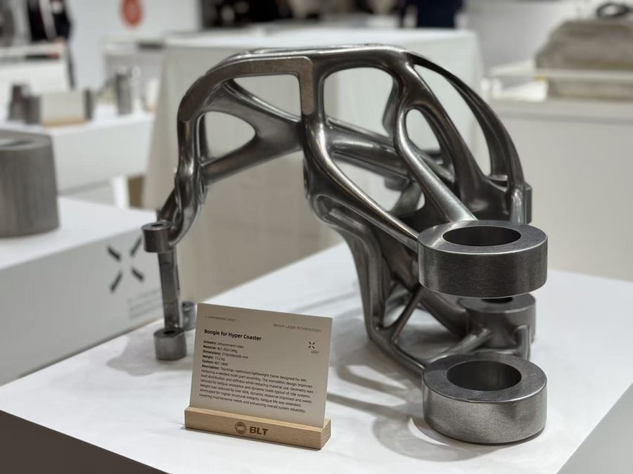 Topology-optimized titanium additive upper control-arm blank on a pedestal